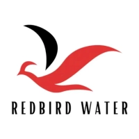 Redbird Water company logo in Lubbock featuring a stylized red and black flying bird emblem