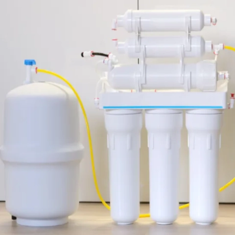 Reed and Son Services LLC Reverse osmosis.png featuring a professional under-sink multi-stage reverse osmosis drinking water filtration system cleanly mounted inside a kitchen vanity base
