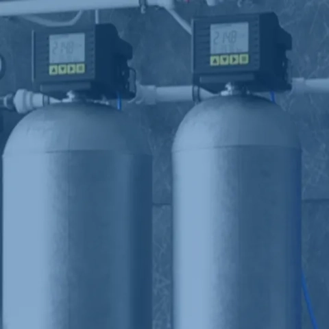 Professional twin-tank continuous-flow residential water softening system engineered to handle bulk water volumes and eliminate scaling minerals, expertly serviced by Rooter-Man