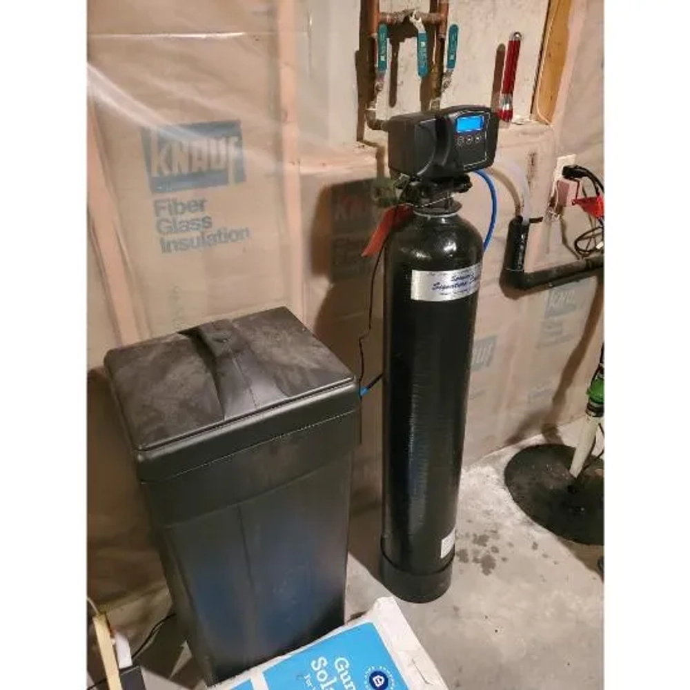 Installed Spencer's Soft Water system with black resin tank, brine tank, and digital control.