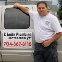 T. Smith Plumbing Contractors Salisbury, NC licensed plumbing and repair services on a company van