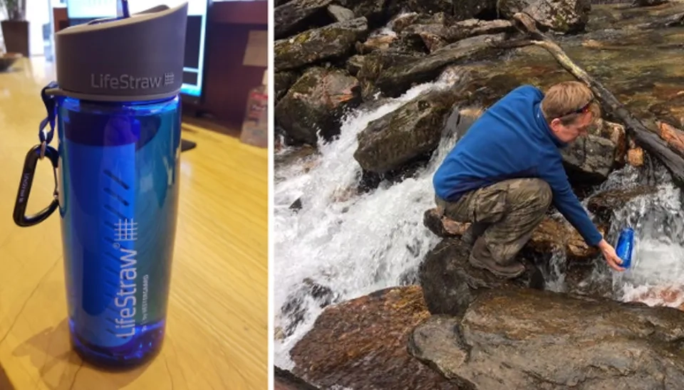 A man using Lifestraw filtered water bottle to purify river water.