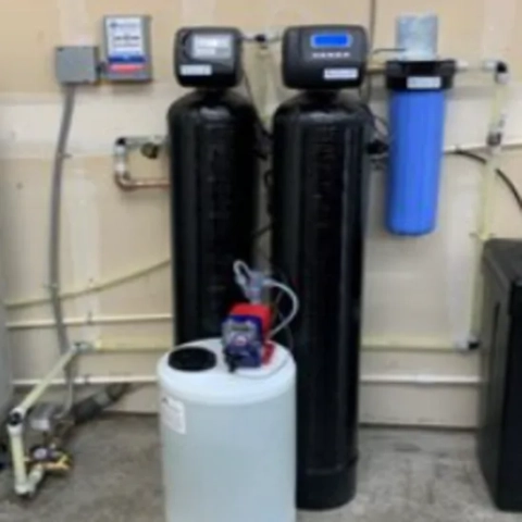 Professional point-of-entry groundwater treatment station integrated with automatic water softening and localized chemical injection infrastructure, expertly engineered by Valley Drilling Corp