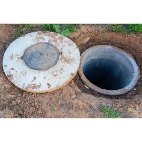Wastewater Consultants licensed technician inspecting a septic system for council compliance in Far North Queensland.