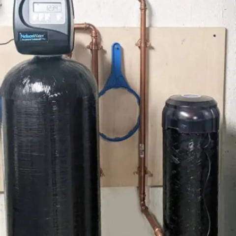 Professional Water Geeks LLC water softening equipment featuring a durable resin tank and controller
