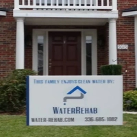 Water Rehab yard sign in Climax, NC, offering water filtration and softening services