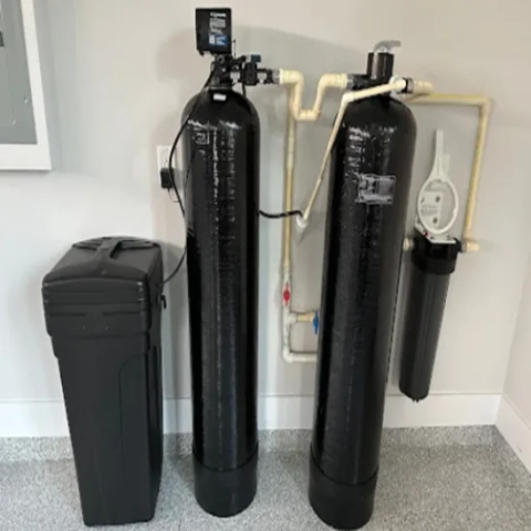 David Gray Plumbing dual-tank water softener with brine tank for whole-home water treatment services.