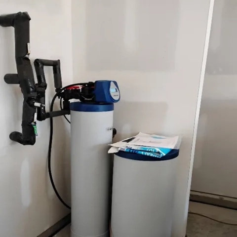 Home water softener installation by North Carolina Water Company in Charlotte, featuring bypass valves.