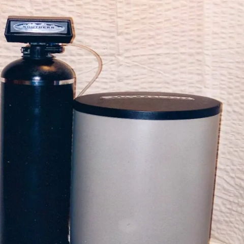 Southern Water Conditioning residential water softener system with resin tank and brine tank.