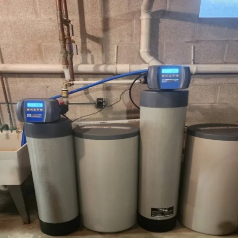 Safeway Water softener and filtration system with digital valves installed in a basement.