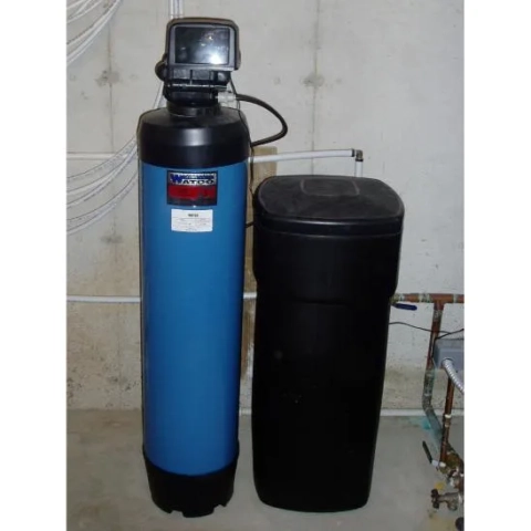Installed blue WaterPro whole house water softener tank alongside a black brine storage tank