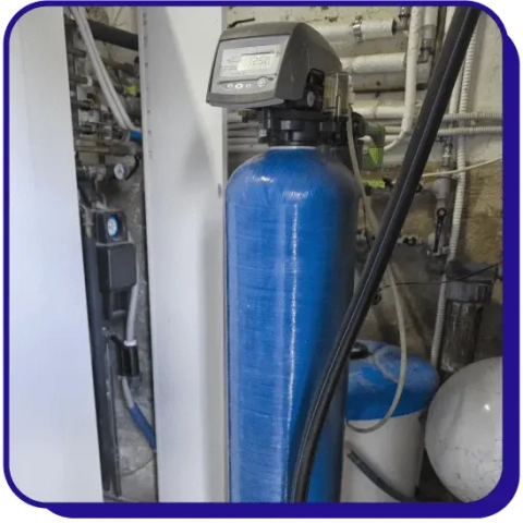 Service Professor whole house water treatment system with a blue filtration tank and digital valve.