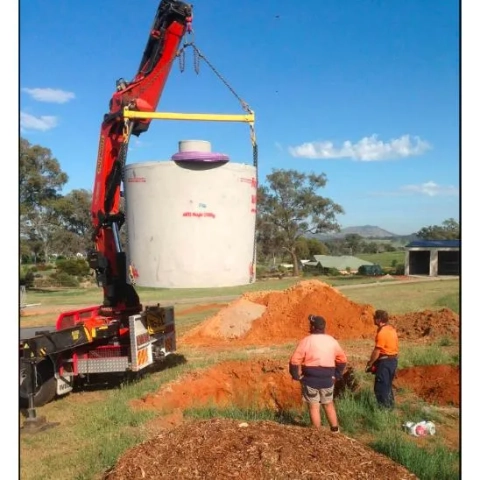 BluenGrey evapotranspiration bed for wastewater disposal in clay soils with gravel and vegetation.