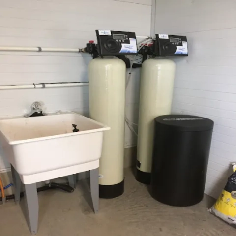 Pristine Water twin-tank softener system with Clear Stream brine tank next to a utility sink.
