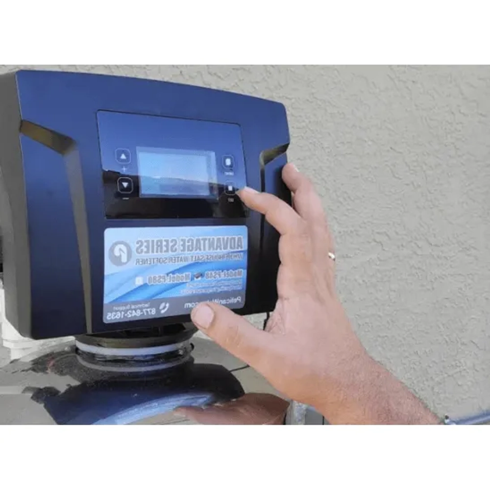 Modern residential water softener by Smart Water Treatment Technology FL featuring smartphone usage monitoring
