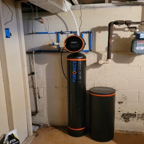 Puronics water softener system installed by BEMOR, with digital control head and PEX plumbing.