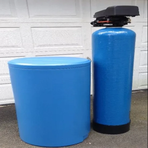 Niagara Water Conditioning Co. water softener system with blue brine tank and tall resin tank.