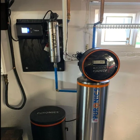 Puronics water softener/filter system with SilverShield® media, combined with Viqua UV light for chemical-free whole-house disinfection.