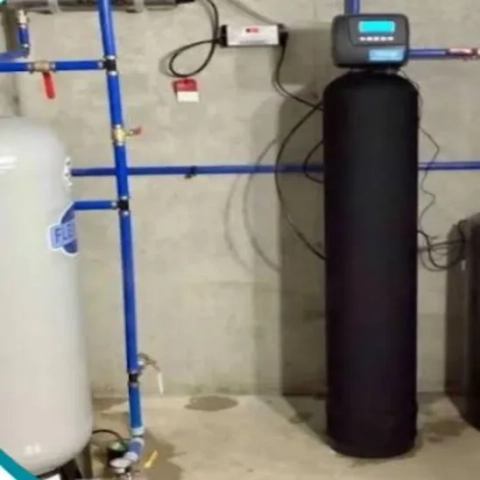 The Clean Plumbers residential water softener installation in Tampa featuring a high-efficiency digital control head